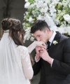 Ben_kisses_Ciara_s_hand_during_nuptials.jpg